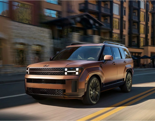 Hyundai Santa Fe driving down street 