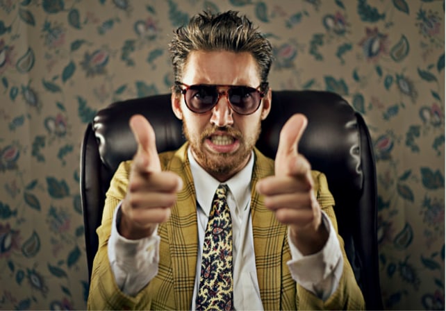 stereotypical sleazy car salesman