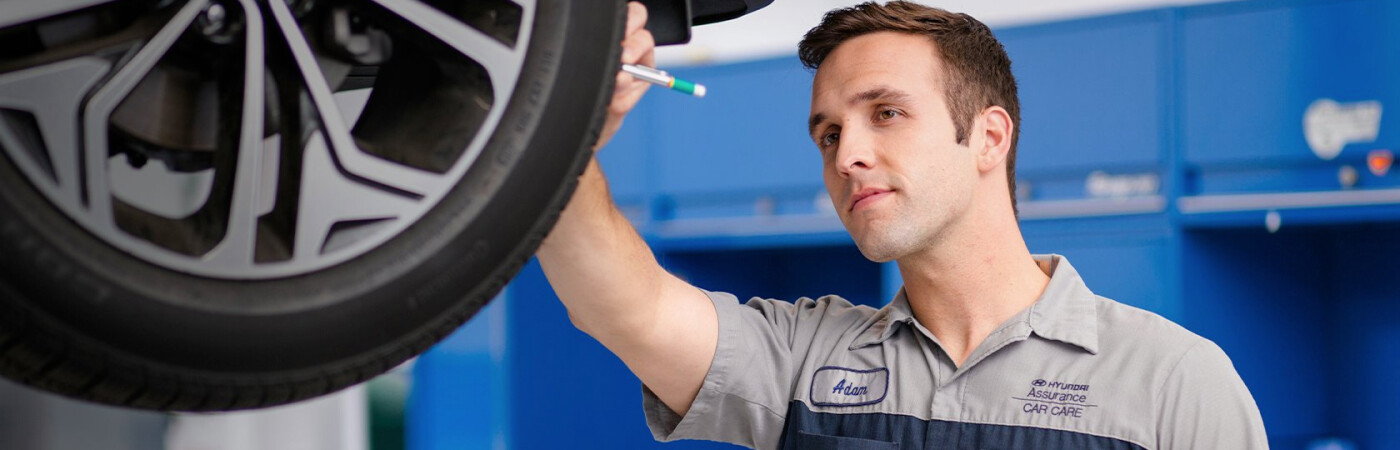 Hyundai Service Technician Checking Tires