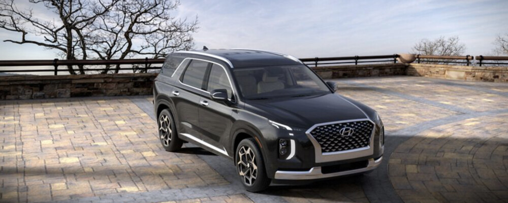 Black 2022 Hyundai Palisade parked on brick drive
