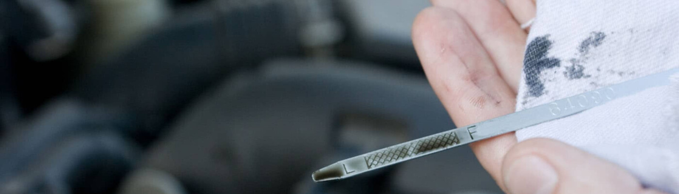 Checking oil level on dipstick